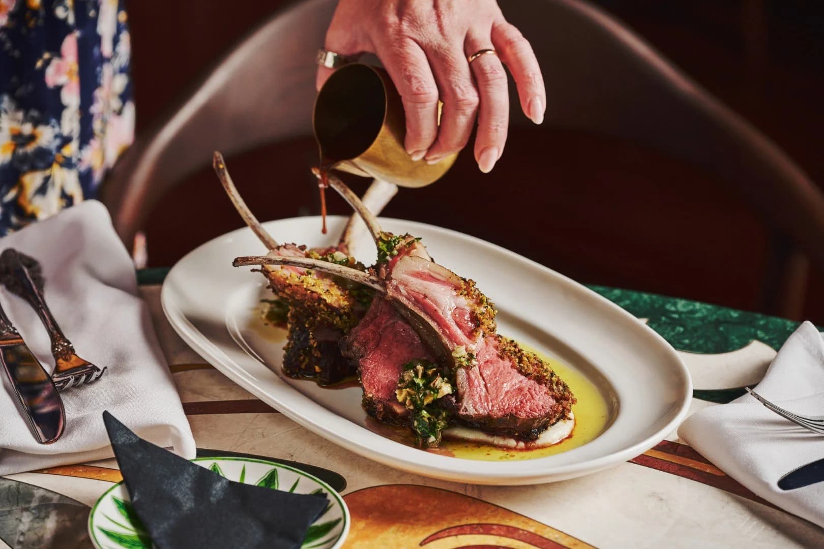 Guests reviewing menus at dinner at The Berczy Tavern, a New Canadian bistro and piano bar in Old Town Toronto