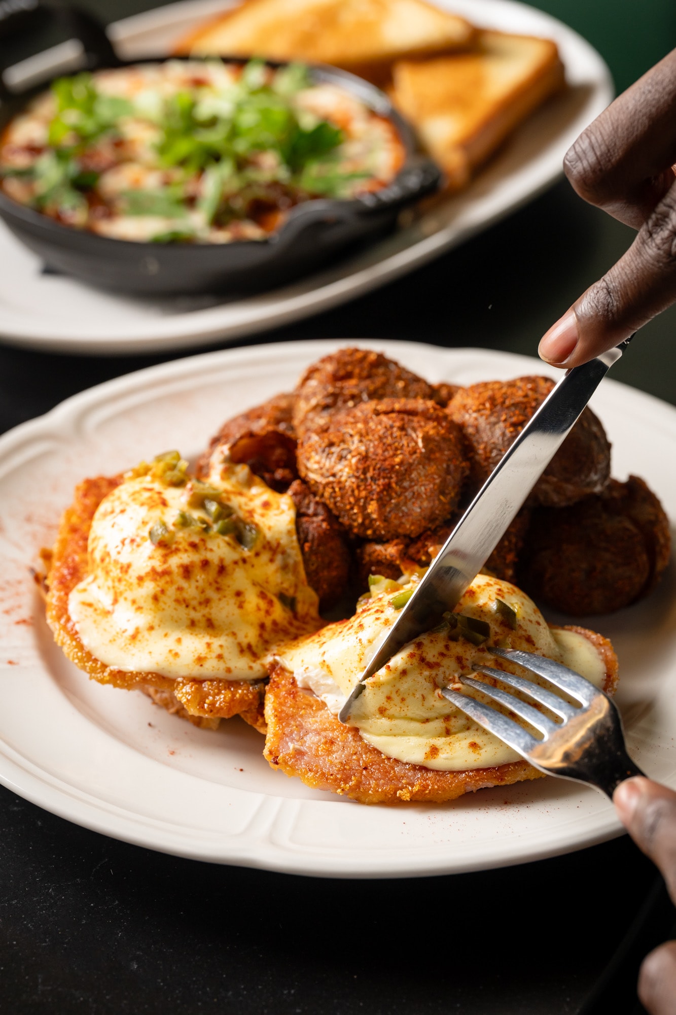 Eggs Benedict being enjoyed at brunch