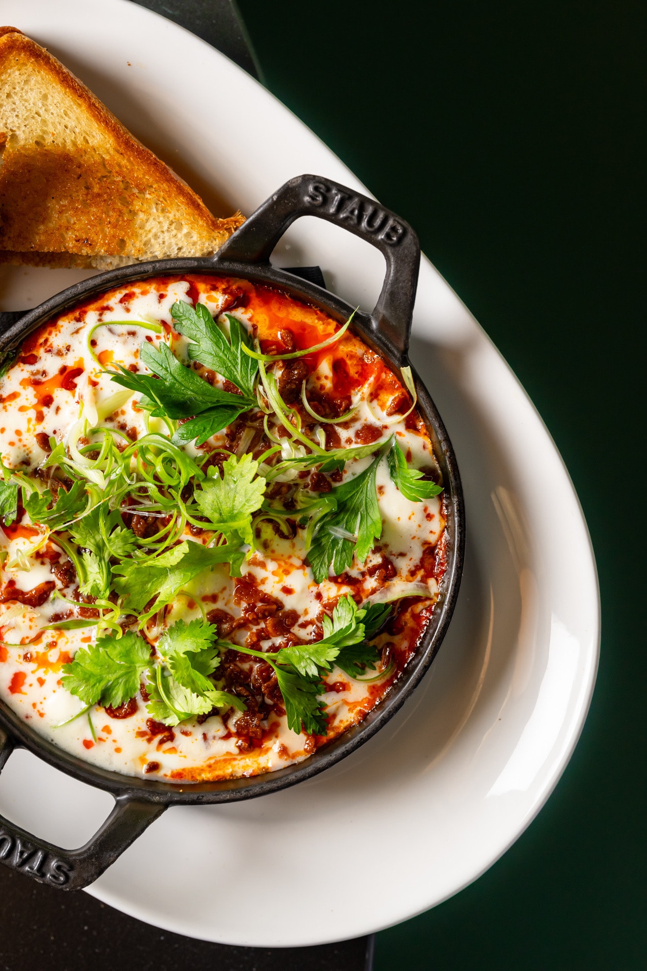 Eggs in Purgatory with stracciatella and toast